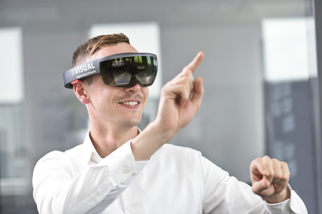 Man with X-Visual Virtual Reality Headset for MR4B Project